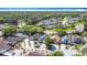 Wide aerial view showing a quiet neighborhood and a community with mature trees at 6921 Blair Dr, Orlando, FL 32818