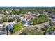 A high-angle aerial view captures the home nestled within a well-established residential area and nearby highway at 6921 Blair Dr, Orlando, FL 32818