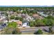 Real estate aerial view showing a neighborhood streetscape with sidewalks and mature trees at 6921 Blair Dr, Orlando, FL 32818