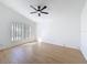 Bright, spacious bedroom with vaulted ceiling, large window, and wood-look floors is move-in ready at 6921 Blair Dr, Orlando, FL 32818