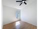 Bedroom featuring hardwood floors and a window for natural lighting at 6921 Blair Dr, Orlando, FL 32818