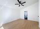 Spacious bedroom features vaulted ceilings, modern ceiling fan, and ensuite bathroom for convenience and privacy at 6921 Blair Dr, Orlando, FL 32818