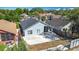 Charming single-story home with gray exterior, dark roof, and a spacious concrete patio at 6921 Blair Dr, Orlando, FL 32818