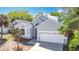 Charming single-story home featuring a two-car garage, well-maintained landscaping, and a freshly painted exterior at 6921 Blair Dr, Orlando, FL 32818