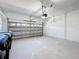 Clean two-car garage with a new door and painted floors at 6921 Blair Dr, Orlando, FL 32818