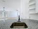 Close-up of a granite countertop and stainless steel sink in a modern kitchen with bright and open layout at 6921 Blair Dr, Orlando, FL 32818