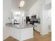 Modern kitchen featuring granite countertops, stainless steel appliances, and white cabinetry, blending style and functionality at 6921 Blair Dr, Orlando, FL 32818