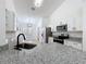 Stylish kitchen with granite countertops, stainless steel appliances, and a modern faucet, perfect for cooking and entertaining at 6921 Blair Dr, Orlando, FL 32818