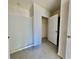 Bright bathroom featuring tile floors, shower with curtain and closet at 992 Serchio St, Haines City, FL 33844