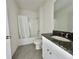 Clean bathroom featuring granite countertop vanity, toilet, and shower-tub combo at 992 Serchio St, Haines City, FL 33844