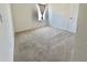 Carpeted bedroom with a window and neutral walls and door for lots of natural light at 992 Serchio St, Haines City, FL 33844