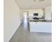 Bright kitchen with granite countertops, stainless steel appliances, and white cabinetry at 992 Serchio St, Haines City, FL 33844