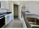 Modern kitchen with granite countertops, stainless steel refrigerator, and ample cabinet space at 992 Serchio St, Haines City, FL 33844