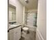 Bathroom features a granite vanity top, toilet, and a bathtub-shower combination with tiled floors at 994 King Parc Rd, Orange City, FL 32763