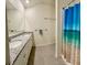 Well-lit bathroom featuring double sinks, granite countertops, and a stand up shower at 994 King Parc Rd, Orange City, FL 32763