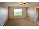 Bright, carpeted bedroom with a large window and neutral walls at 994 King Parc Rd, Orange City, FL 32763