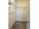 Walk-in closet with carpet floors and a sturdy wire shelving system for efficient storage at 994 King Parc Rd, Orange City, FL 32763