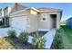 Charming single-story home with a two-car garage and well-maintained landscaping at 994 King Parc Rd, Orange City, FL 32763