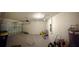 Spacious garage offers ample storage and parking with a neutral palette, awaiting personalization and organization at 994 King Parc Rd, Orange City, FL 32763