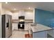 Well-lit kitchen with stainless steel appliances, granite countertops and bright white cabinetry at 994 King Parc Rd, Orange City, FL 32763