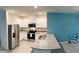 Modern kitchen with stainless steel appliances, granite countertops, and white cabinetry at 994 King Parc Rd, Orange City, FL 32763