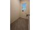 Cozy laundry room featuring tile floors, bright light from window, and washer-dryer hookups at 994 King Parc Rd, Orange City, FL 32763