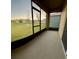 Enclosed patio overlooking the backyard with seamless screens and outdoor space at sunset at 994 King Parc Rd, Orange City, FL 32763