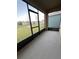 Enclosed patio overlooking the backyard with seamless screens and outdoor space at 994 King Parc Rd, Orange City, FL 32763