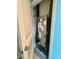 Utility closet featuring a new HVAC unit, along with a louvered door for ventilation at 994 King Parc Rd, Orange City, FL 32763