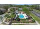 A birdseye view of the community pool surrounded by tropical landscaping at 10785 Corsican St # 3, Orlando, FL 32824
