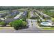 Aerial view of a townhome community showcasing pool and entry gate at 10785 Corsican St # 3, Orlando, FL 32824