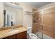 Bathroom with tiled shower and granite vanity at 10785 Corsican St # 3, Orlando, FL 32824