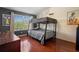 Comfortable bedroom featuring bunk beds and a bright window at 10785 Corsican St # 3, Orlando, FL 32824