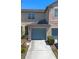 Charming townhome with an attached one car garage, landscaped walkway and manicured bushes at 10785 Corsican St # 3, Orlando, FL 32824