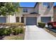 Charming townhome with a well-manicured front yard and attached two-car garage at 10785 Corsican St # 3, Orlando, FL 32824