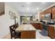 Spacious kitchen features stainless appliances, granite countertops, and island seating at 10785 Corsican St # 3, Orlando, FL 32824