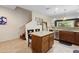 Spacious kitchen with central island, bar seating, and stainless appliances at 10785 Corsican St # 3, Orlando, FL 32824