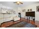 Sunlit living room features an open floor plan with wood floors, a white sectional, and kitchen views at 10785 Corsican St # 3, Orlando, FL 32824