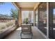 Relaxing outdoor patio with a table and chairs, a screened enclosure, and views of the backyard at 10785 Corsican St # 3, Orlando, FL 32824