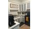 Traditional kitchen with white cabinets and a black range at 1110 E Edgewood Dr, Lakeland, FL 33803