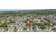 An aerial view of a neighborhood with arrow pointing to a home and surrounding landscaping at 122 Carmel Bay Dr, Sanford, FL 32771