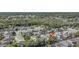 An aerial view of a neighborhood with arrow pointing to a home, landscaping, and nearby lake at 122 Carmel Bay Dr, Sanford, FL 32771