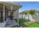 An outdoor patio featuring tile flooring, a grill, seating, and decorative details at 122 Carmel Bay Dr, Sanford, FL 32771