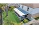 A screened-in porch, a grilling area and a yard make this backyard inviting at 122 Carmel Bay Dr, Sanford, FL 32771