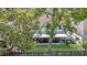 An aerial view of a home's backyard featuring a screened-in patio and well-maintained lawn at 122 Carmel Bay Dr, Sanford, FL 32771