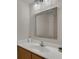 Modern bathroom vanity with a mirror, sink, and updated fixtures at 122 Carmel Bay Dr, Sanford, FL 32771