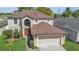 Charming two-story home with a well-manicured lawn and attached two car garage at 122 Carmel Bay Dr, Sanford, FL 32771