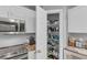 Spacious pantry with wire shelving provides ample storage space for kitchen essentials at 122 Carmel Bay Dr, Sanford, FL 32771