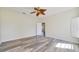 Spacious bedroom with laminate flooring and a ceiling fan at 13850 Mirror Lake Dr, Orlando, FL 32828