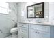 Modern bathroom featuring marble tiling, a sleek vanity, and a contemporary vessel sink at 1456 Providence Blvd, Deltona, FL 32725